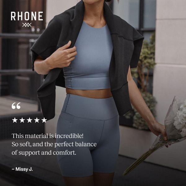 A 1:1 ratio ad featuring a model wearing athletic shorts and a top, highlighted by a five-star customer review centered on material comfort.